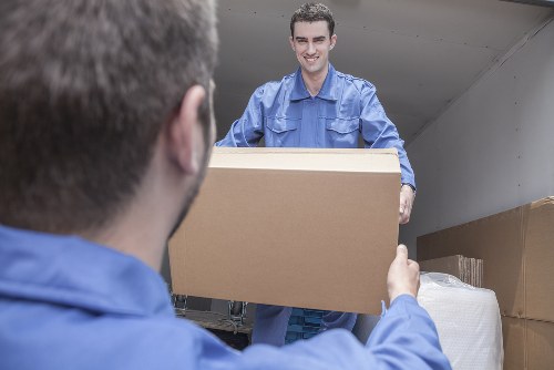 Man and van vehicle loading household items for transport
