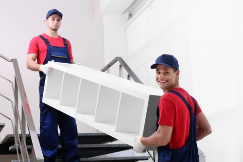 Removal van and moving crew in a Hampstead residential street