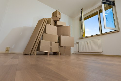 Removal team planning a house move on a Hampstead residential street