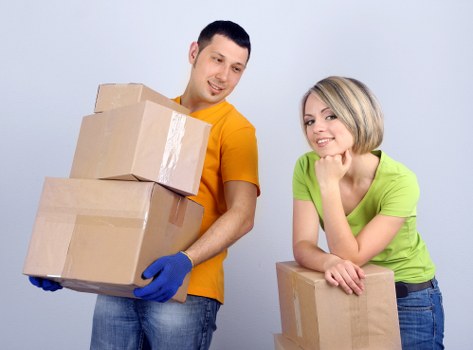 Commercial moving team working in a Hampstead street with office boxes