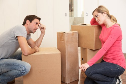 Professional movers handling household items with care during transport