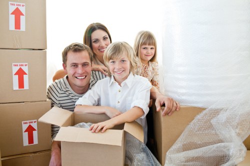 Movers loading household items into a removal van in Hampstead