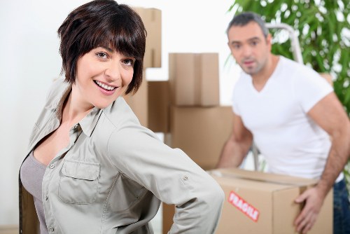 Packing and loading furniture into a moving truck in Hampstead