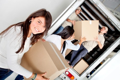 Relocation team managing office furniture transport in Hampstead