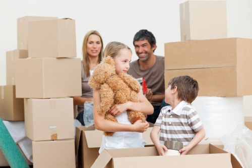 Removal team handling boxed belongings during a booked service