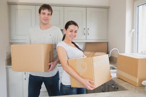 Professional moving truck unloading items in Hampstead